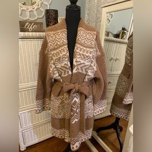 Never been worn.  New with NO tags.  LUCKY BRAND woman’s XL.  TAN/White knit